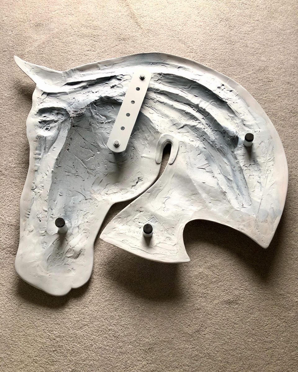 Rear casting and bespoke hanging mechanism