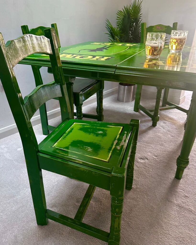 Sherwood table and green chairs with bee tankards by artist Leigh Kelsey