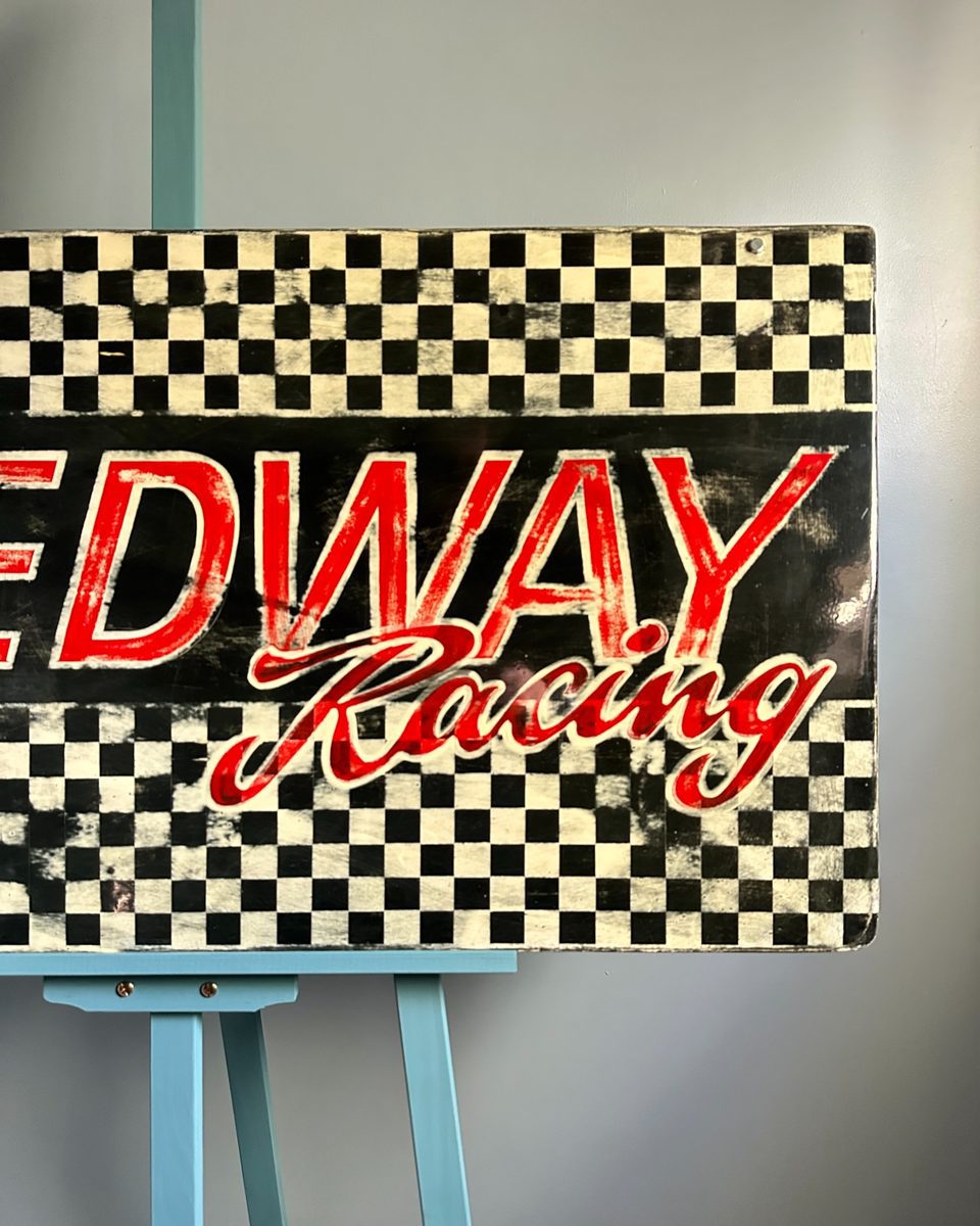 Speedway sign — lettering and chequerboard detail